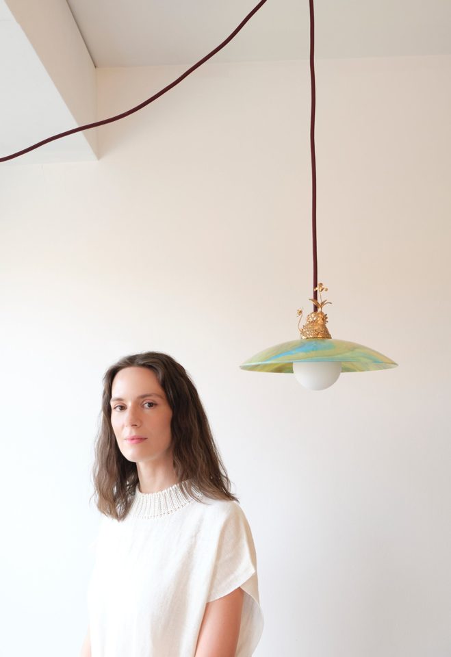 Artist Julia Blume beside the Lauba pendant lamp